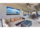 Comfortable covered patio featuring a sectional sofa and coffee table at 44192 W Canyon Creek Dr, Maricopa, AZ 85139