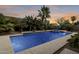 Inviting rectangular pool with surrounding landscaping at 44192 W Canyon Creek Dr, Maricopa, AZ 85139