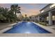 Inviting pool with spacious patio and landscape at 44192 W Canyon Creek Dr, Maricopa, AZ 85139