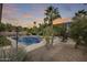Refreshing pool surrounded by lush landscaping at 44192 W Canyon Creek Dr, Maricopa, AZ 85139