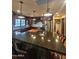 Spacious kitchen island featuring bar seating and granite countertops at 49 W Secretariat Dr, Tempe, AZ 85284