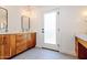 Modern bathroom with dual vanities and a frosted glass door at 5112 N 35Th St, Phoenix, AZ 85018