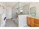 Modern bathroom with walk-in shower and wood cabinets at 5112 N 35Th St, Phoenix, AZ 85018