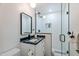 Clean bathroom with a walk-in shower, marble vanity and mirror at 5112 N 35Th St, Phoenix, AZ 85018