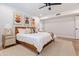 Bright bedroom with wood flooring, a king-size bed, and modern artwork at 5112 N 35Th St, Phoenix, AZ 85018