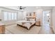 Spacious bedroom with a king-size bed, light wood furniture, and en-suite bathroom at 5112 N 35Th St, Phoenix, AZ 85018