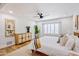 Bright bedroom featuring a king-size bed, light wood furniture, and large windows at 5112 N 35Th St, Phoenix, AZ 85018