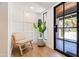Bright entryway with modern chair and large window at 5112 N 35Th St, Phoenix, AZ 85018