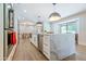 Bright kitchen boasts a marble island, stainless steel appliances, and hardwood floors at 5112 N 35Th St, Phoenix, AZ 85018