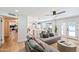 Living room with gray sectional sofa, wood floors, and access to backyard at 5112 N 35Th St, Phoenix, AZ 85018