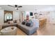 Spacious living room with gray sectional sofa and a ceiling fan at 5112 N 35Th St, Phoenix, AZ 85018