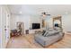 Relaxing living room with gray sectional sofa and large framed art at 5112 N 35Th St, Phoenix, AZ 85018