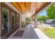Covered patio with wood ceiling, access to kitchen and backyard at 5112 N 35Th St, Phoenix, AZ 85018