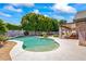 Relaxing kidney shaped pool with patio and lush landscaping at 5112 N 35Th St, Phoenix, AZ 85018