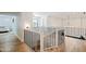 Upstairs hall with modern staircase and wood floors at 5112 N 35Th St, Phoenix, AZ 85018