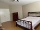 Bedroom with hardwood floors and a dresser at 5222 W Buffalo St, Chandler, AZ 85226