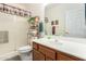 Bathroom with shower, toilet and wood vanity at 5450 E Mclellan Rd # 234, Mesa, AZ 85205