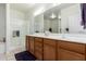 Double vanity bathroom with a large mirror and shower at 5450 E Mclellan Rd # 234, Mesa, AZ 85205