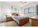 Bright bedroom with a wooden bed frame and nightstands at 5450 E Mclellan Rd # 234, Mesa, AZ 85205