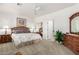 Main bedroom with a king-size bed and wooden furniture at 5450 E Mclellan Rd # 234, Mesa, AZ 85205