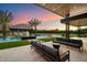 Expansive backyard oasis with a large pool and outdoor seating at 5823 N Invergordon Rd, Paradise Valley, AZ 85253