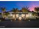 Stunning modern home exterior at dusk, with palm trees and mountain backdrop at 5823 N Invergordon Rd, Paradise Valley, AZ 85253