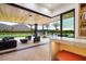 Open living area with sliding doors to outdoor oasis and mountain views at 5823 N Invergordon Rd, Paradise Valley, AZ 85253