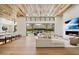 Open concept living space with hardwood floors, modern fireplace and pool views at 5823 N Invergordon Rd, Paradise Valley, AZ 85253