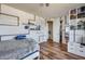 Cozy bedroom with wood floors and built-in shelving at 5826 W Plum Rd, Phoenix, AZ 85083