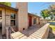 Front view of a brick house with red door and walkway at 6421 S Stanley Pl # C, Tempe, AZ 85283