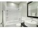 Modern bathroom with white subway tile and a bathtub at 706 E Washington St # 202, Phoenix, AZ 85034