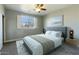 Bright bedroom with a comfortable bed and large window at 706 E Washington St # 202, Phoenix, AZ 85034