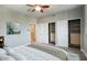 Spacious bedroom with large closet and ceiling fan at 706 E Washington St # 202, Phoenix, AZ 85034