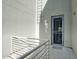 Secure building entrance with a metal security door and private balcony at 706 E Washington St # 202, Phoenix, AZ 85034
