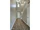 Bright and airy entryway with high ceilings, chandelier, and hardwood floors at 706 E Washington St # 202, Phoenix, AZ 85034