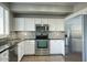 Modern kitchen with stainless steel appliances and granite counters at 706 E Washington St # 202, Phoenix, AZ 85034