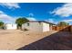 Large backyard with gravel, wooden fence, and storage shed at 952 S Esperanza Ave, Mesa, AZ 85208