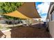 Backyard with shade sail, gravel, and chain link fence at 952 S Esperanza Ave, Mesa, AZ 85208