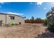 Backyard with gravel ground cover and wooden fence at 952 S Esperanza Ave, Mesa, AZ 85208