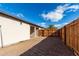 Backyard view showing a gravel area and wooden fence at 952 S Esperanza Ave, Mesa, AZ 85208