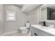Updated bathroom featuring a gray vanity, modern fixtures, and a shower/tub combo at 952 S Esperanza Ave, Mesa, AZ 85208