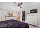 Main bedroom with a large bed, ample closet space, and dresser at 952 S Esperanza Ave, Mesa, AZ 85208