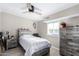 Bright bedroom with wood-like flooring, a full-size bed, and ample closet space at 952 S Esperanza Ave, Mesa, AZ 85208