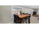Charming dining area with a wooden table and four chairs, perfect for Gathering meals at 952 S Esperanza Ave, Mesa, AZ 85208