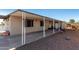 Covered patio with gravel yard and storage shed at 952 S Esperanza Ave, Mesa, AZ 85208