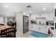 Modern kitchen with white cabinets, new appliances, and quartz countertops at 952 S Esperanza Ave, Mesa, AZ 85208