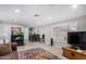 Spacious living room features a comfortable couch and large windows, showcasing natural light at 952 S Esperanza Ave, Mesa, AZ 85208