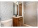 Small bathroom with shower and floral wallpaper at 1018 W Ivanhoe St, Chandler, AZ 85224