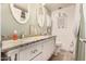 Bathroom with granite countertop, double vanity, and decorative mirrors at 1018 W Ivanhoe St, Chandler, AZ 85224