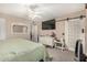 Bright bedroom with ceiling fan, dresser, and barn door at 1018 W Ivanhoe St, Chandler, AZ 85224